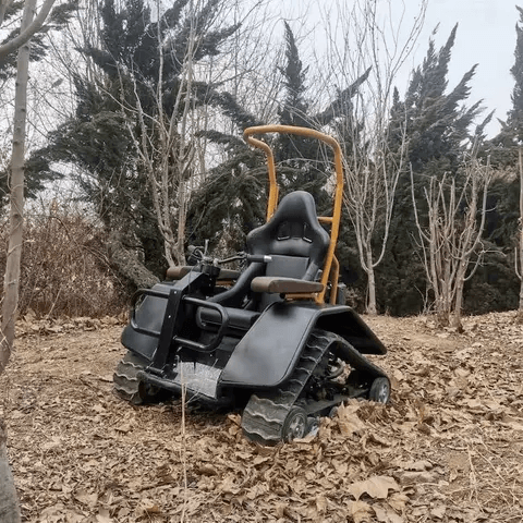 Black electric wheelchair with tan roll bar and thick tread tracks for rough terrain
