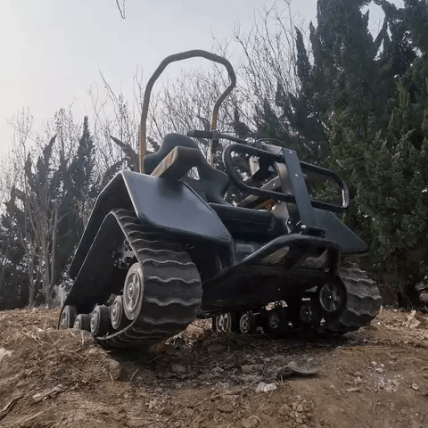 Black electric all-terrain wheelchair with front shelter canopy and track drive system