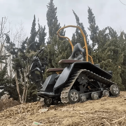 All-terrain electric wheelchair in black with enclosed cockpit and multi-wheel base