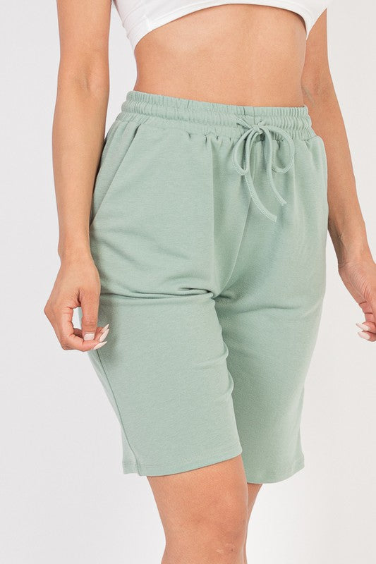 French terry bermuda shorts in mint green with elastic waistband and bow-tied drawstring