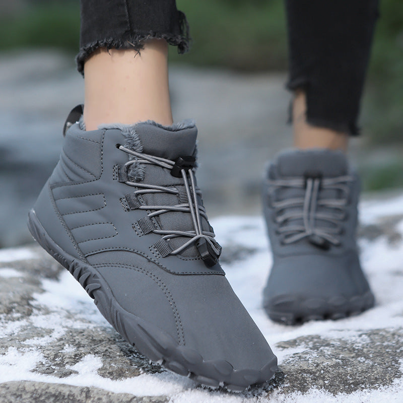 Light gray snow boots with fuzzy cuff and lace-up front, grippy rubber outsole
