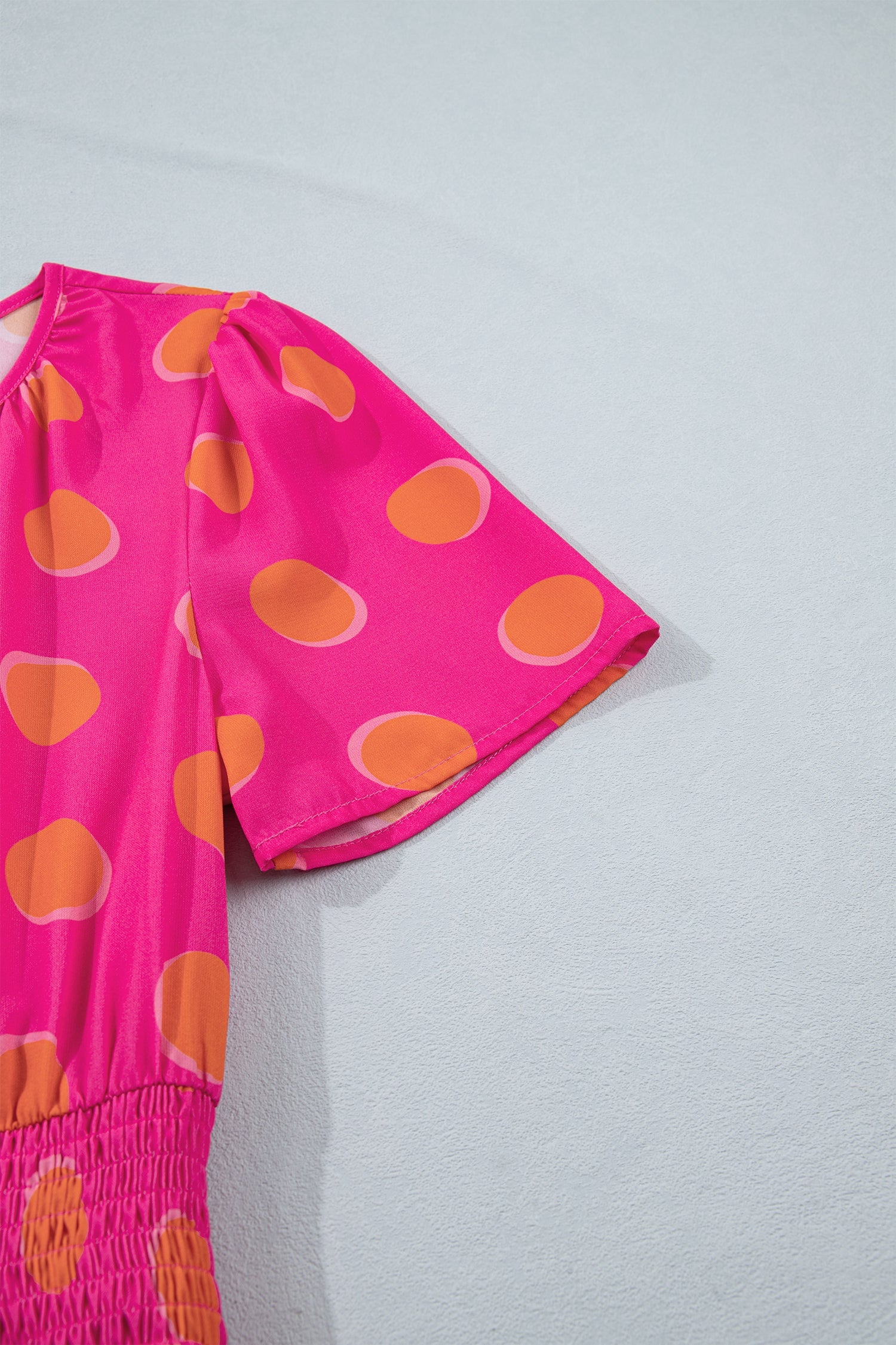 Rose high waist midi dress with orange oval polka dots and short puff sleeves