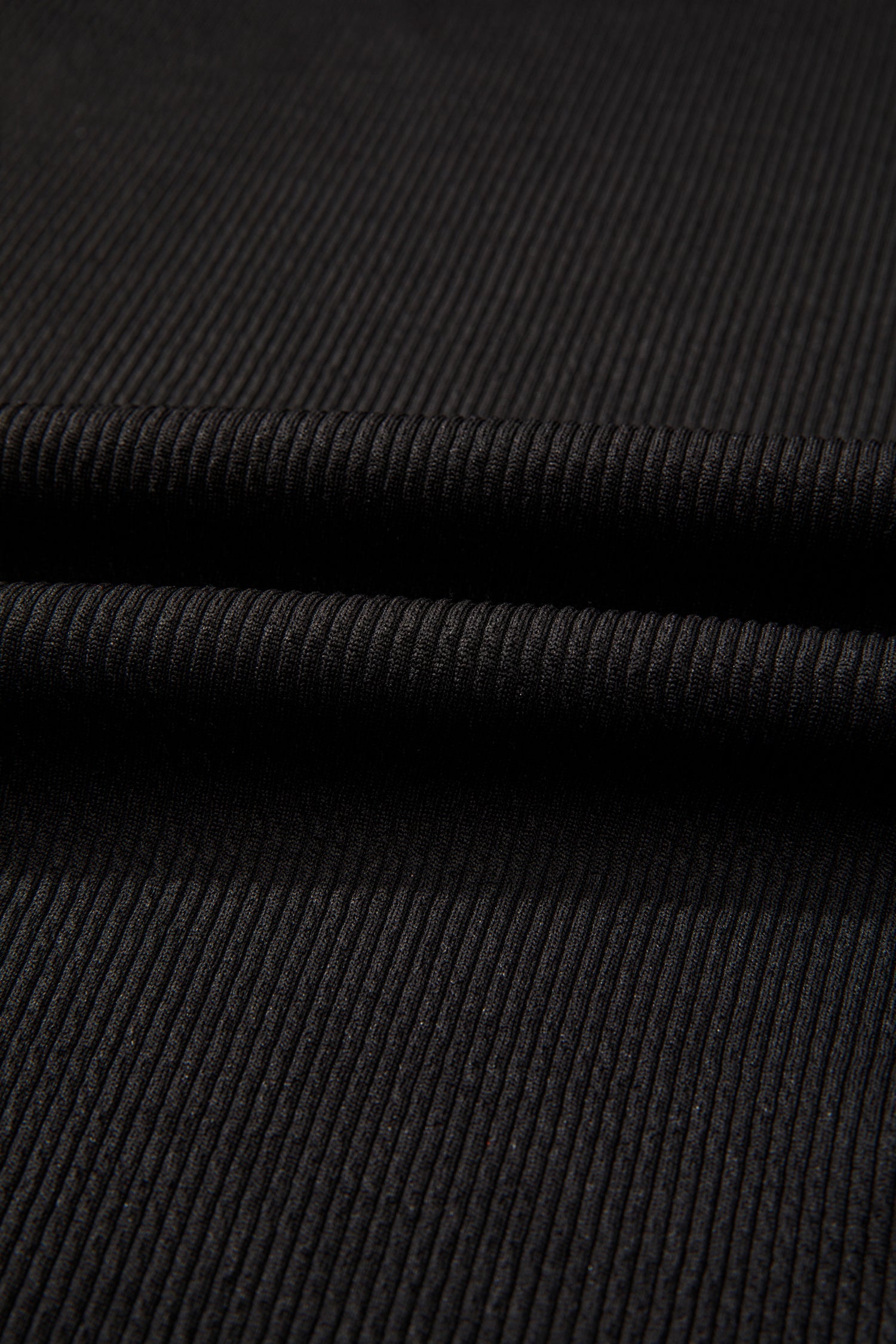 Black ribbed fabric with horizontal seam and layered construction