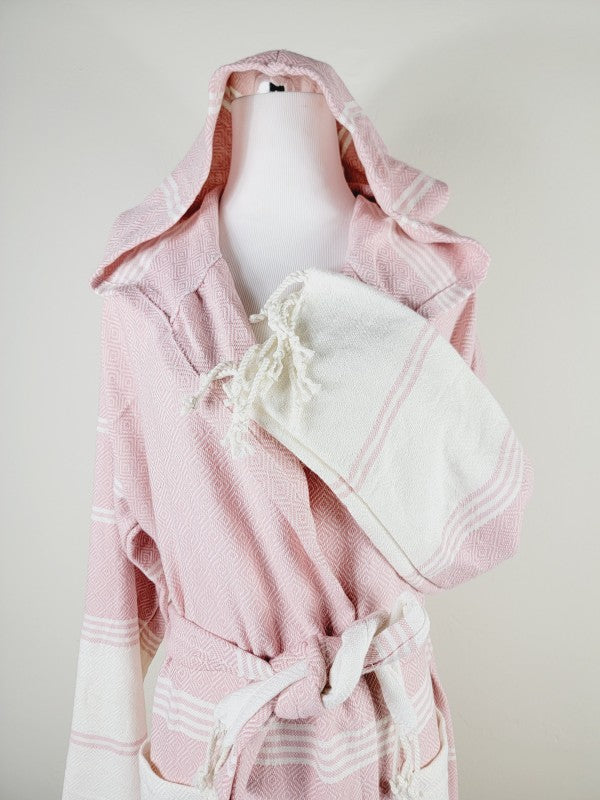 Pink robe with hood and tie belt; side pocket and striped sleeve cuff visible