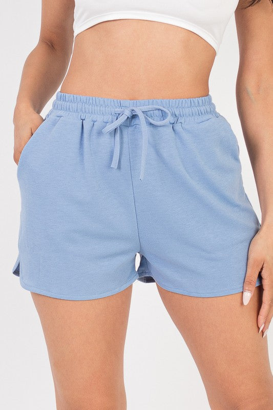 Light blue French terry active shorts with elastic waistband and drawstring