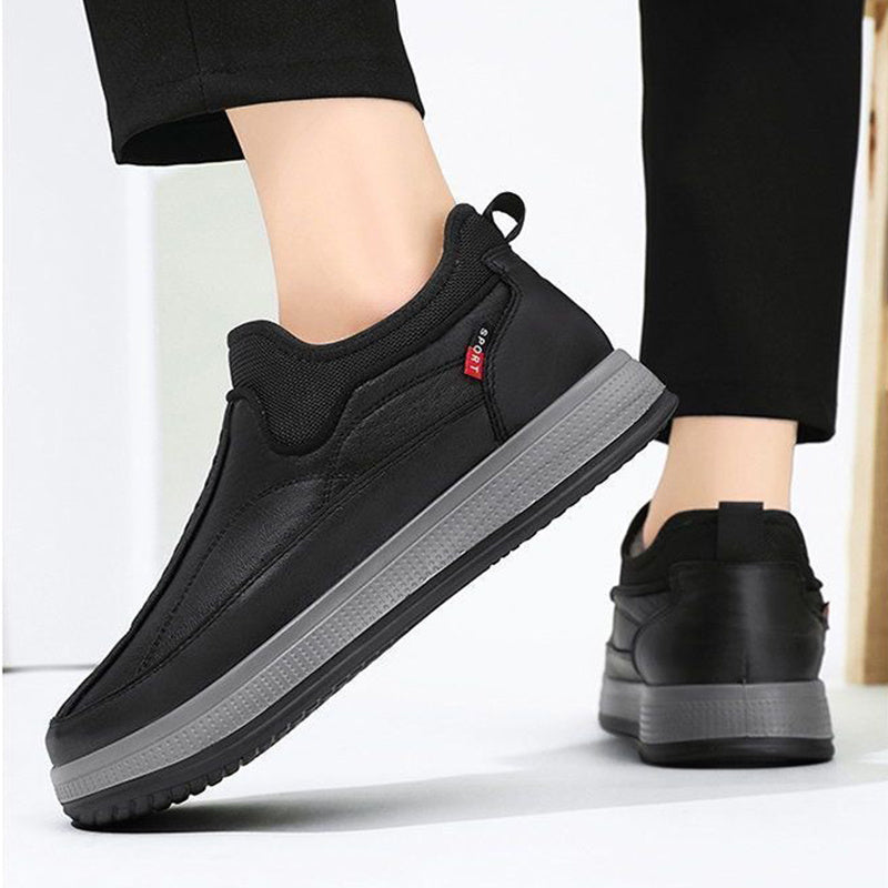 Black slip-on ankle boots with fleece lining and textured platform sole