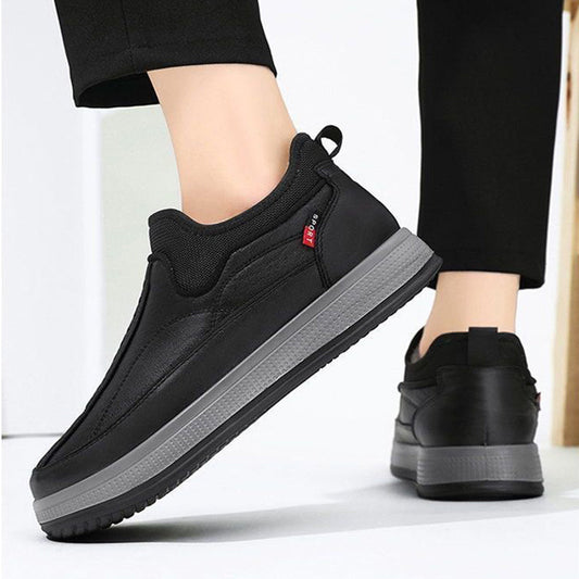 Black slip-on ankle boots with fleece lining and textured platform sole