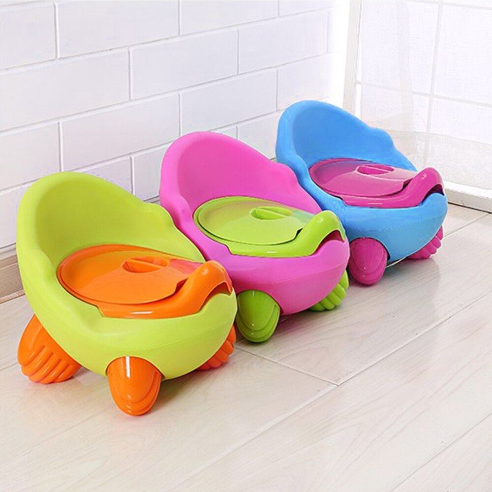 Kids cartoon potty stools in lime green and pink with blue stool in the background