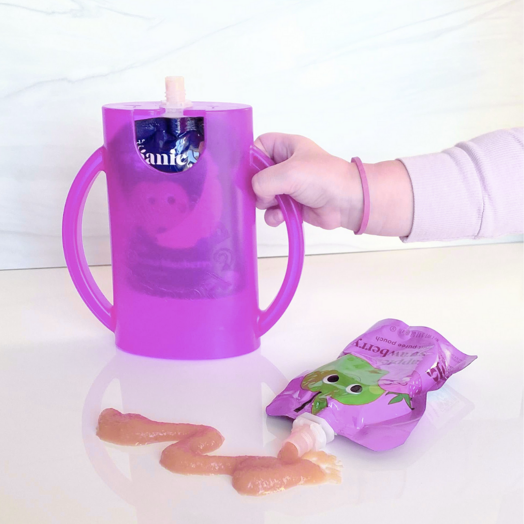 Purple flipping holder with side handles, standing on a table with a food pouch