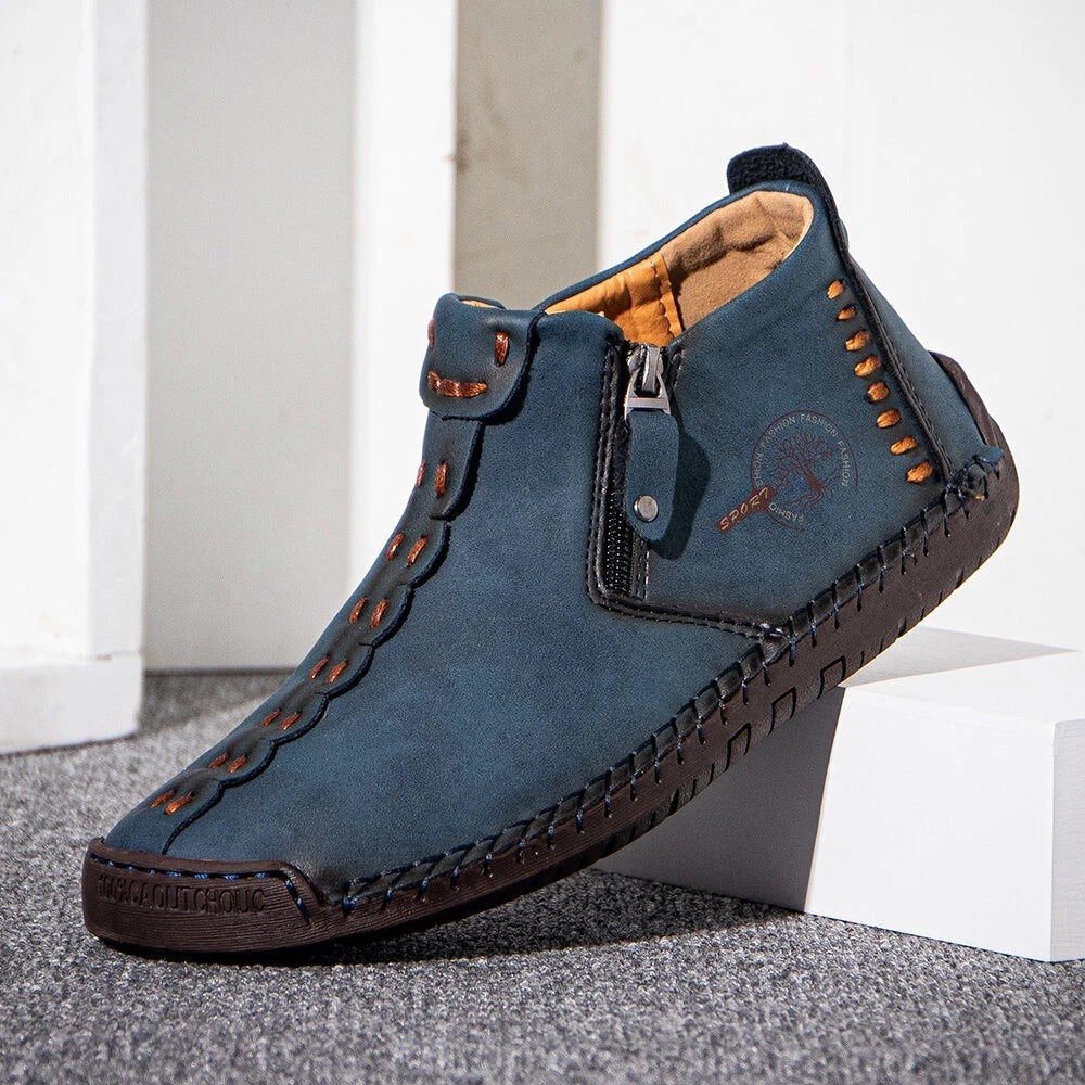 Blue men's ankle boots with side zipper, stitched leather upper and rubber tread sole