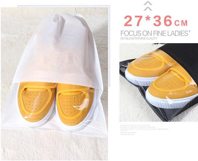 White drawstring shoe storage bag with clear top, holding yellow shoes.