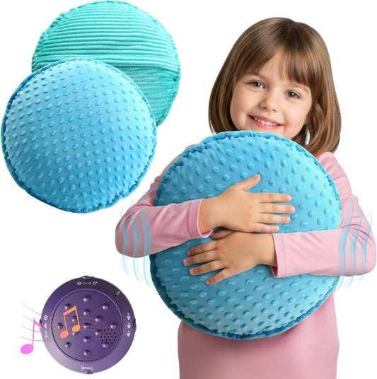 Blue-green textured plush sensory pillow with raised dots, hugged in front of a child.
