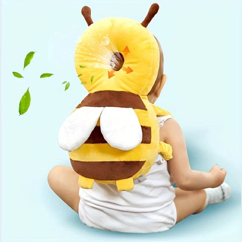 Bee head protection cushion with yellow body, white wings, and brown stripe