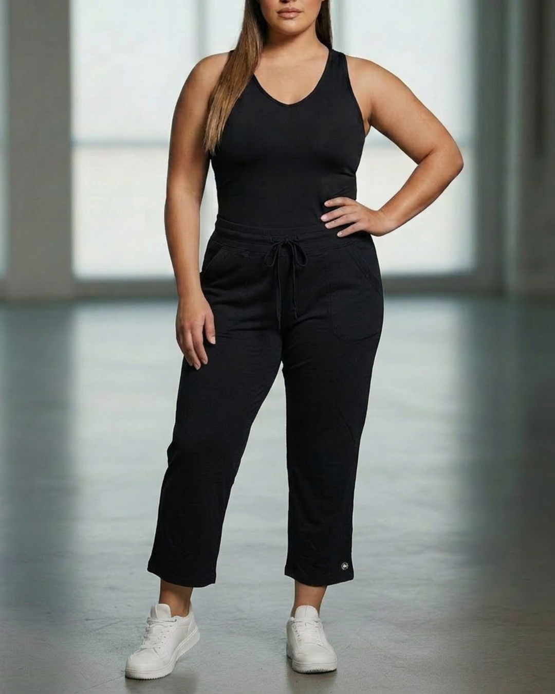 Relaxed capri pants, black with drawstring elastic waist and cropped hems.