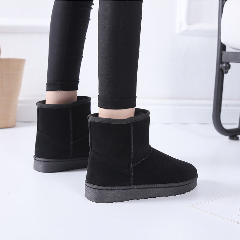 Women’s winter snow boots in black suede with faux fur lining and grippy outsole