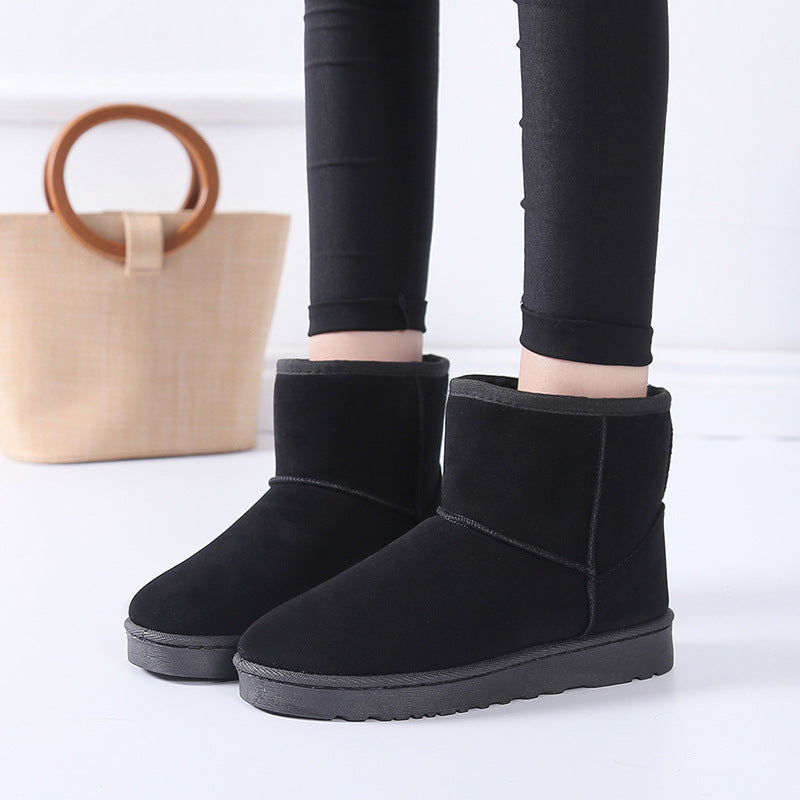 Women’s winter snow boots in black suede with faux fur lining and cushioned outsole