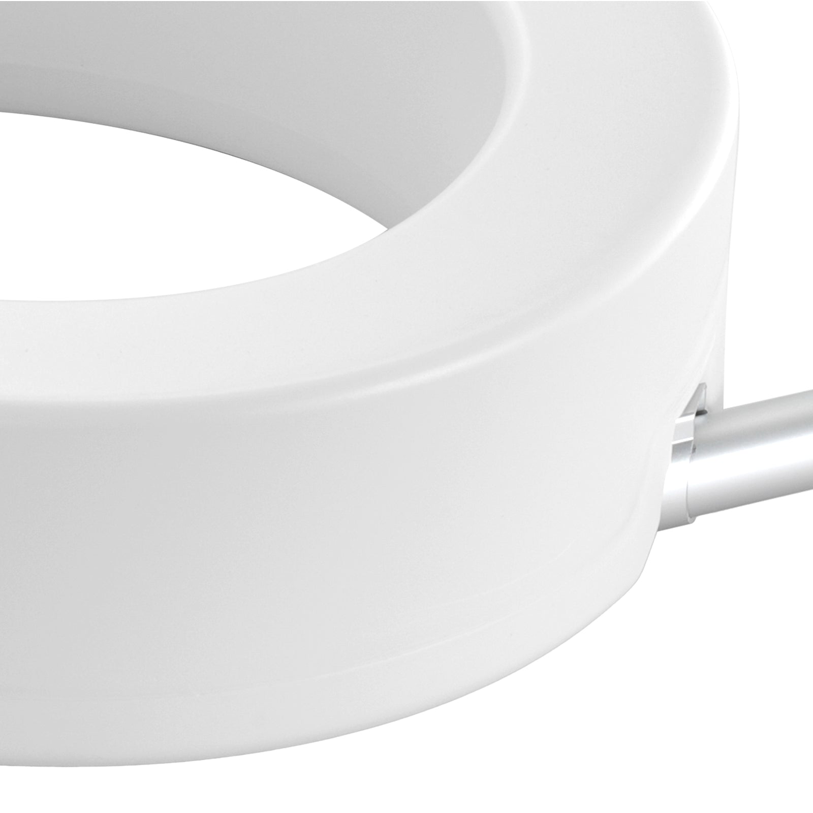 Raised toilet seat close-up of white seat rim and side support structure