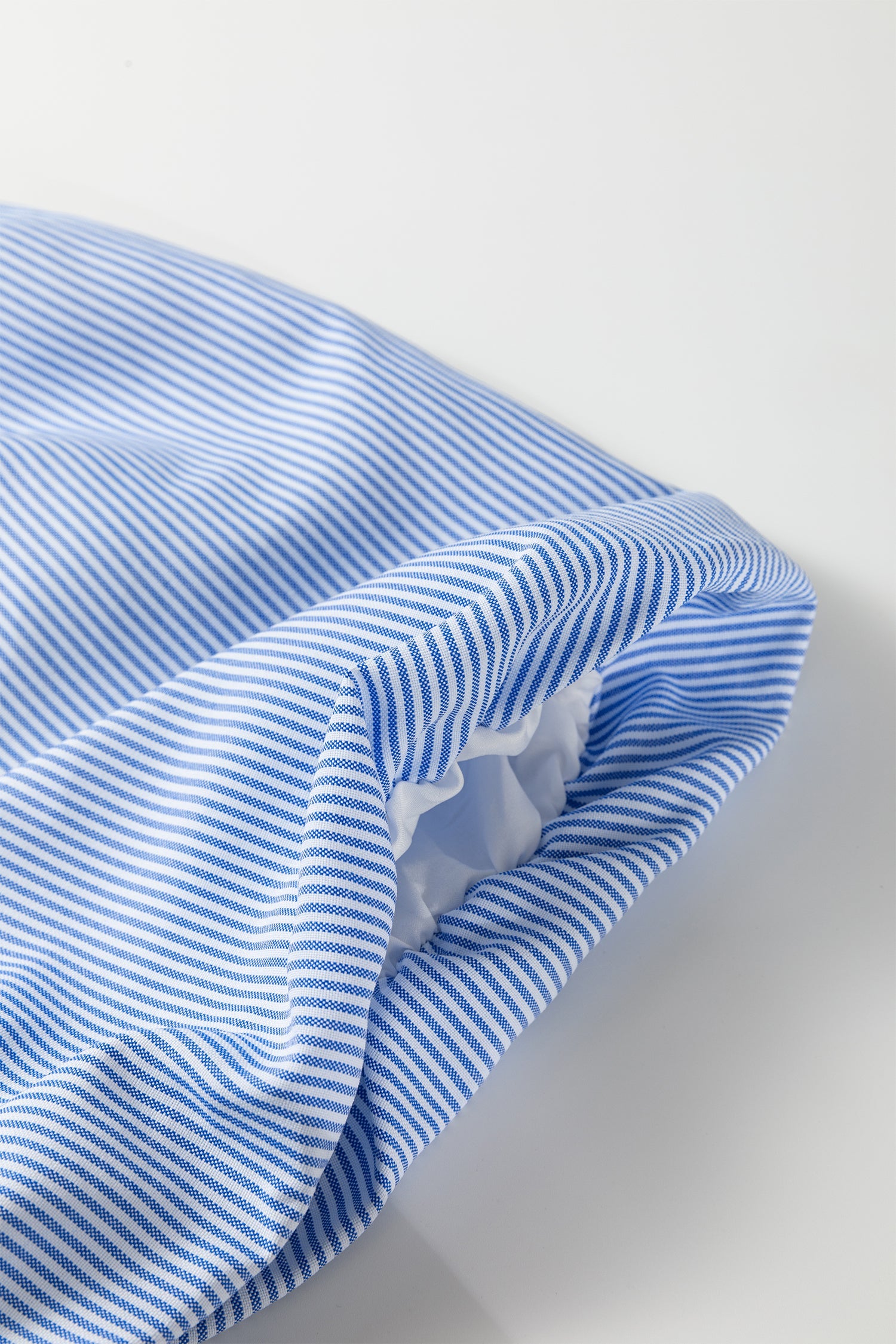 Ruffled cuff and layered fabric on sky blue striped puff sleeve