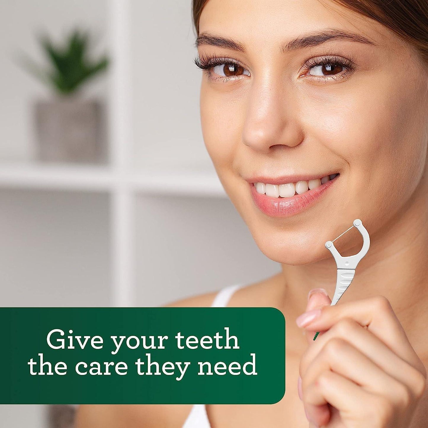2-in-1 dental floss pick held near mouth