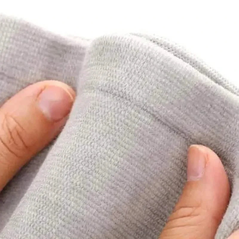 Self-heating knee support pad fabric close-up, light gray knit with textured surface