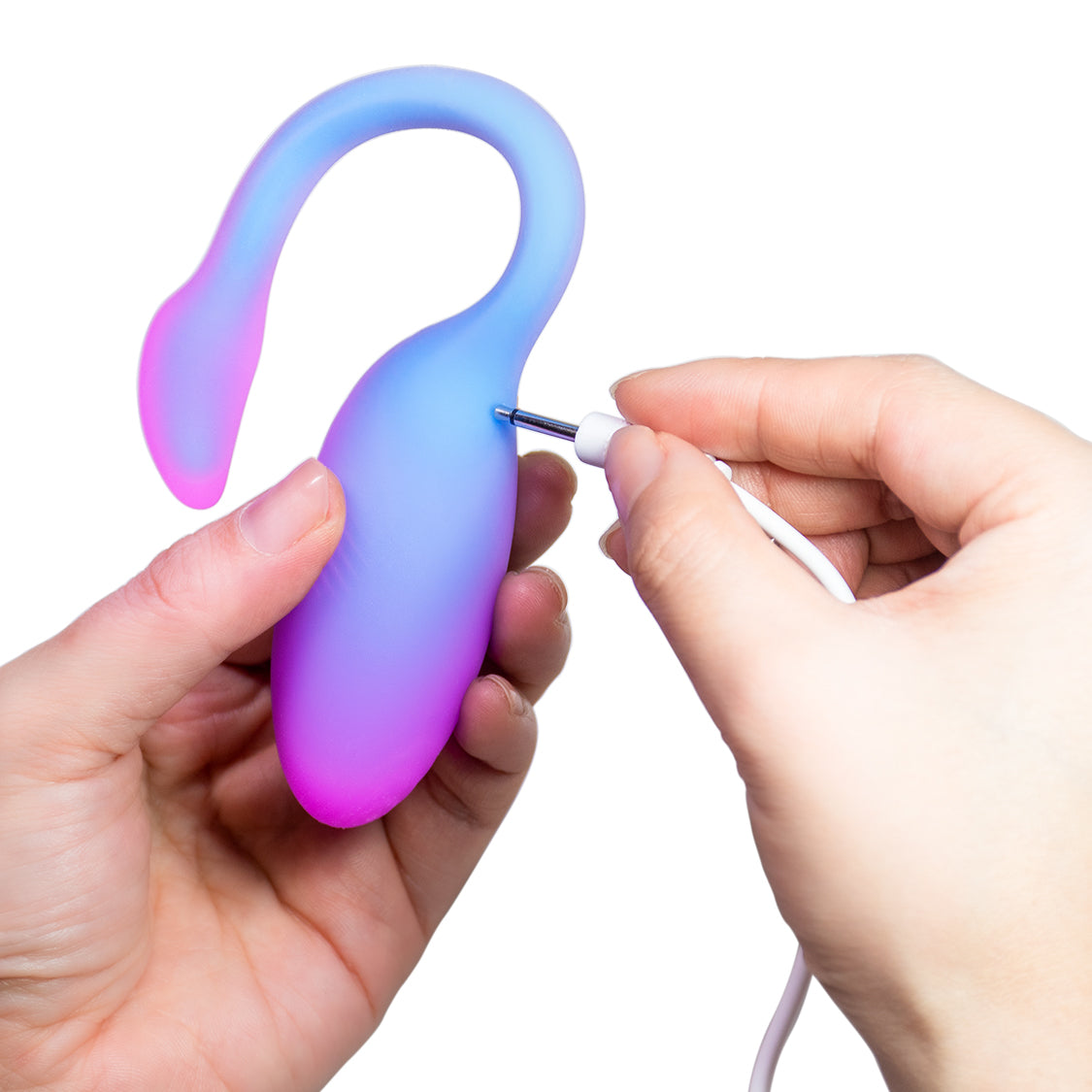 Blue-to-purple flamingo-shaped personal massager being plugged in