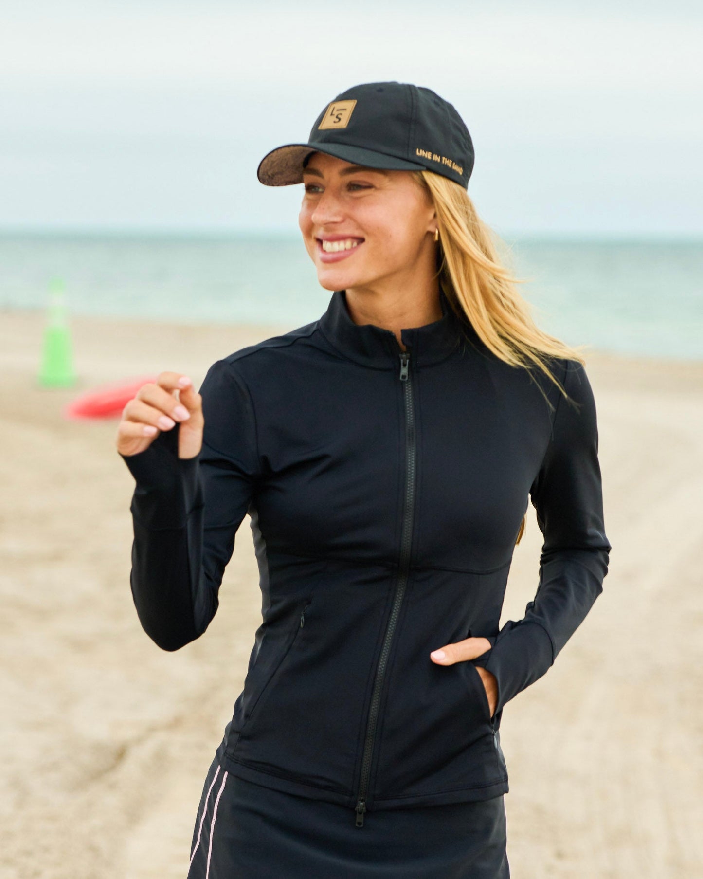 Zip-front jacket in dark navy with stand collar and long sleeves, side pockets