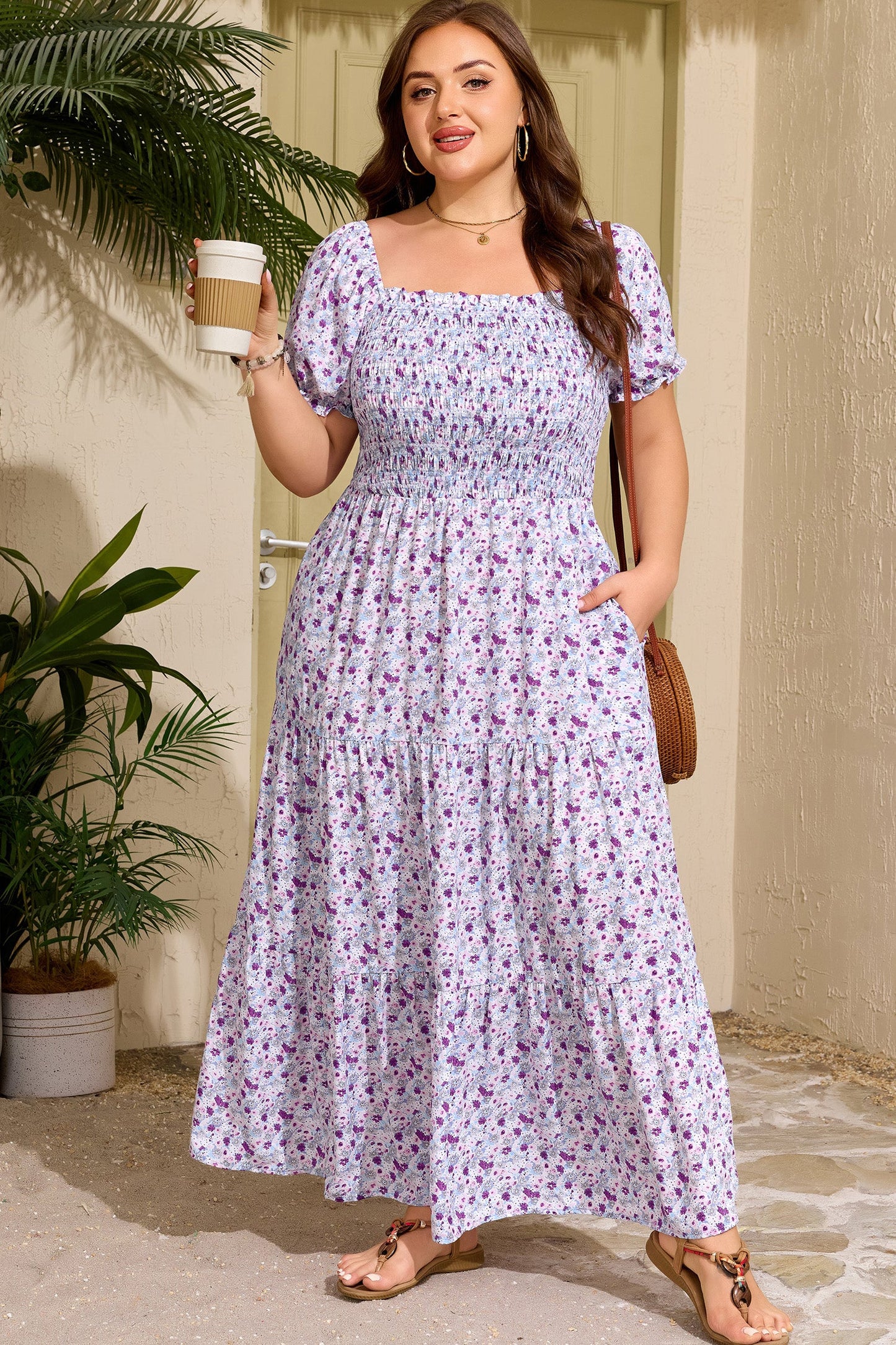 Purple floral smocked maxi dress with square neckline, puff sleeves, and full gathered skirt
