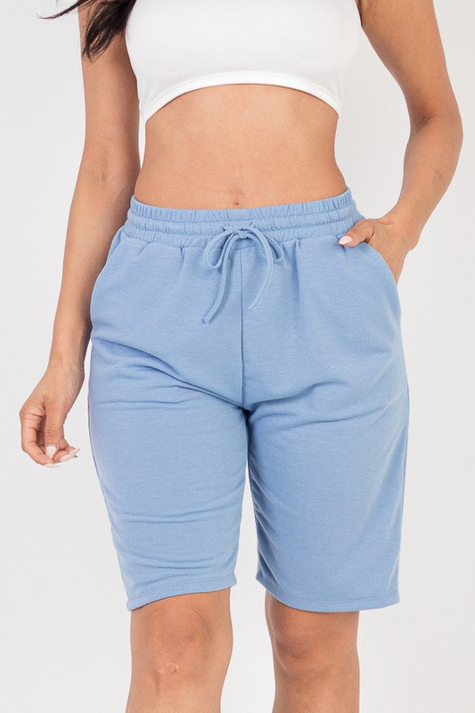 French terry bermuda shorts in light blue with elastic waistband and drawstring