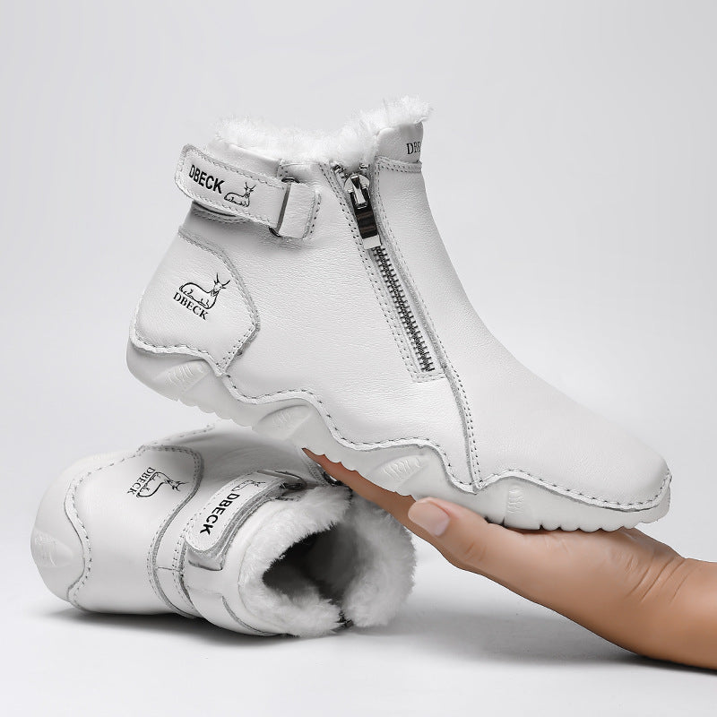 White high-top boots, open heel showing plush lining and side zipper closure.