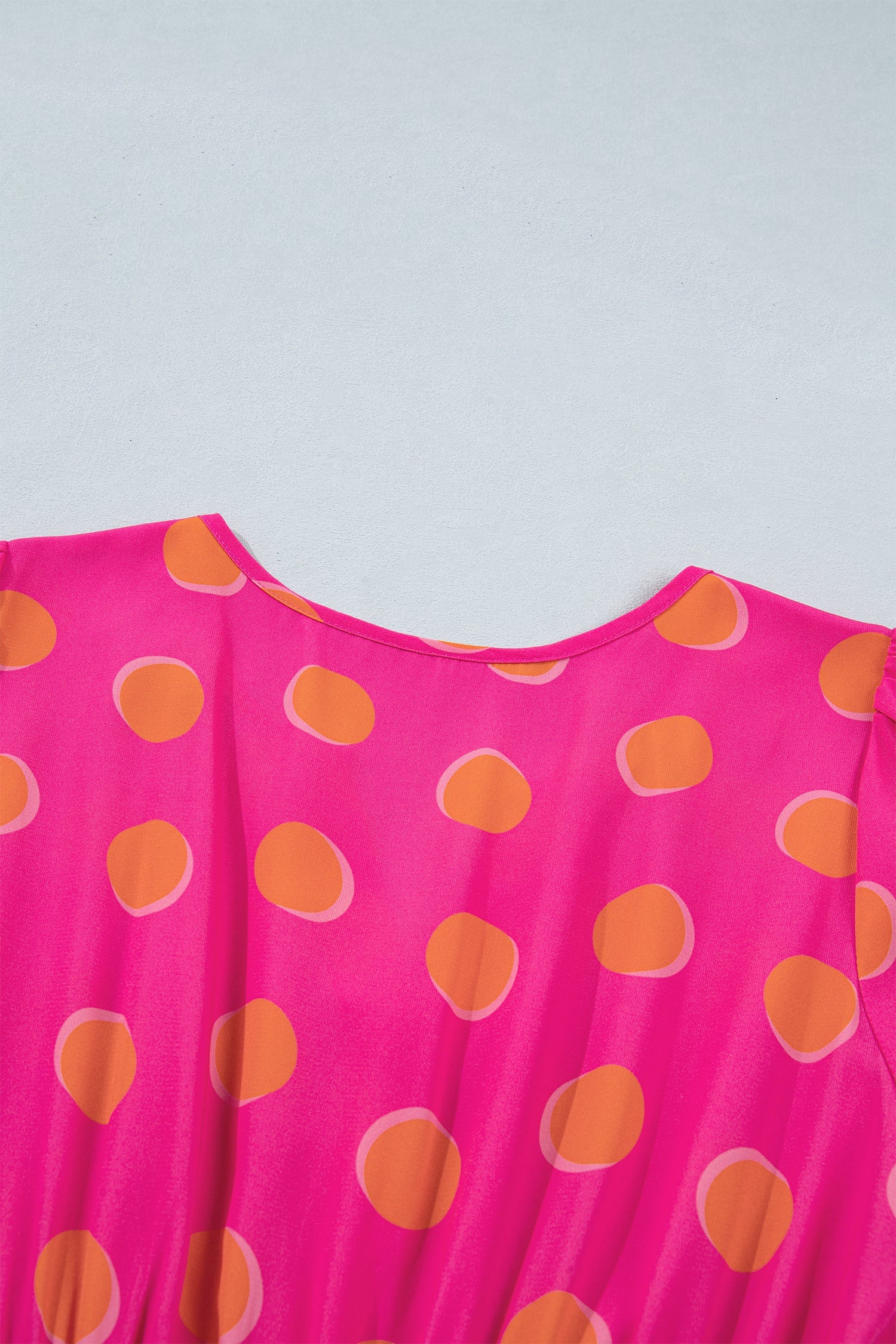 Rose midi dress with high waist and orange oval polka dots, crew neckline