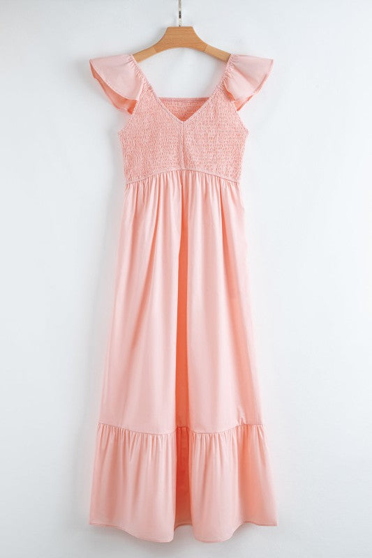 Apricot pink maxi dress on hanger with smocked bodice and flutter sleeves