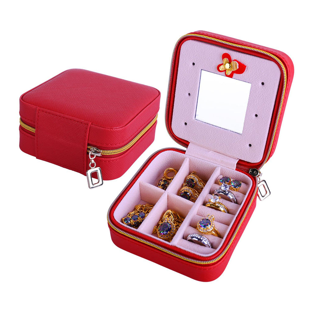 Red PU jewelry organizer case with hinged mirror, zipper, and ring storage compartments