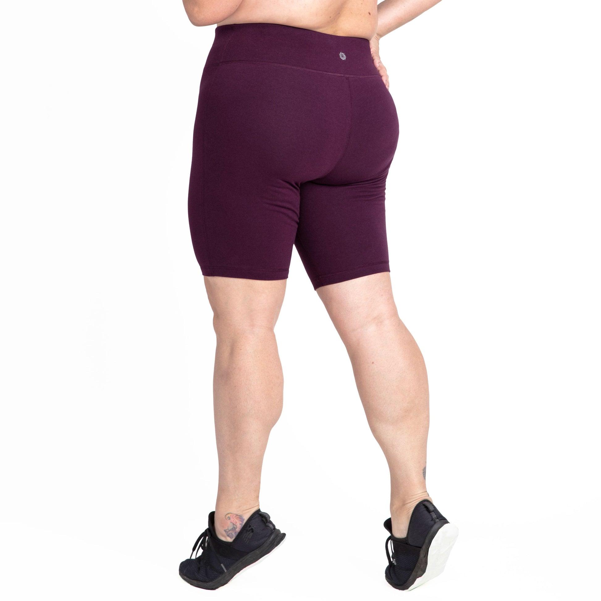 Burgundy bike shorts, mid-thigh length with elastic waistband and small logo