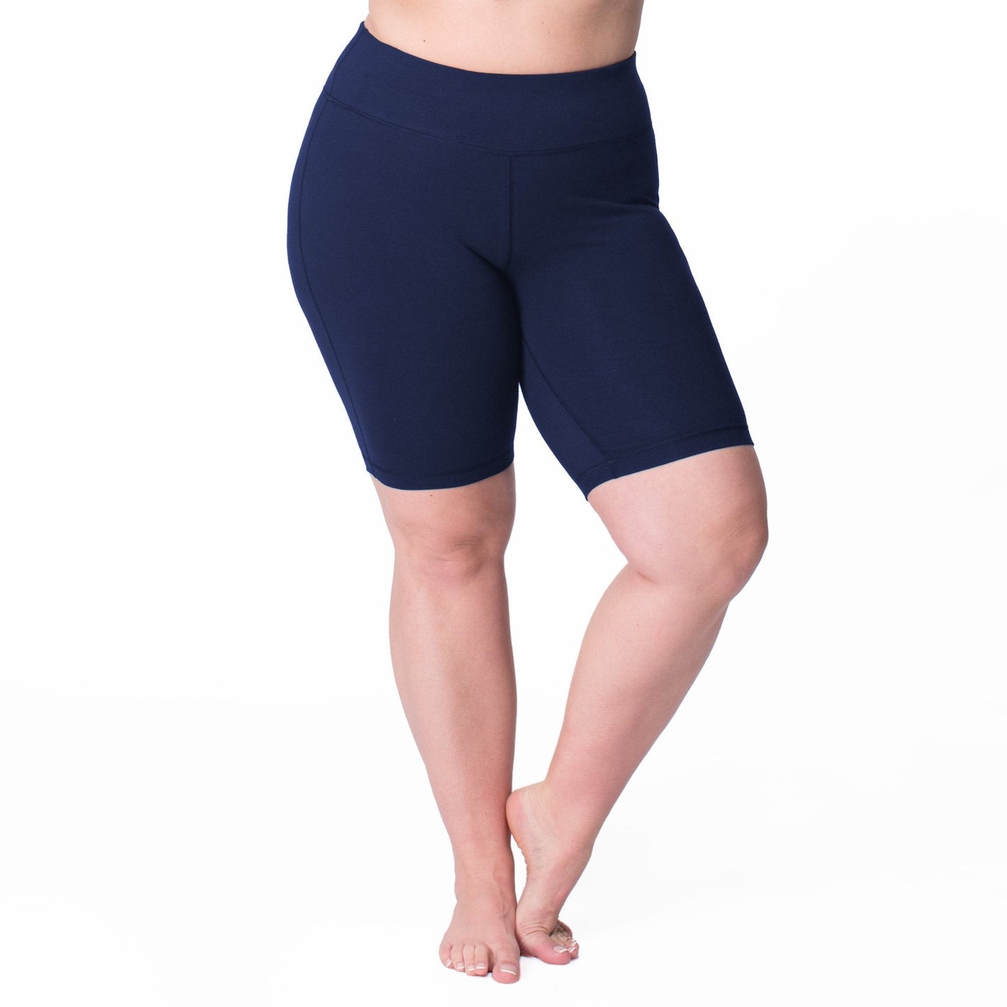 Navy bike shorts, mid-thigh length with contoured seams and small logo at waist