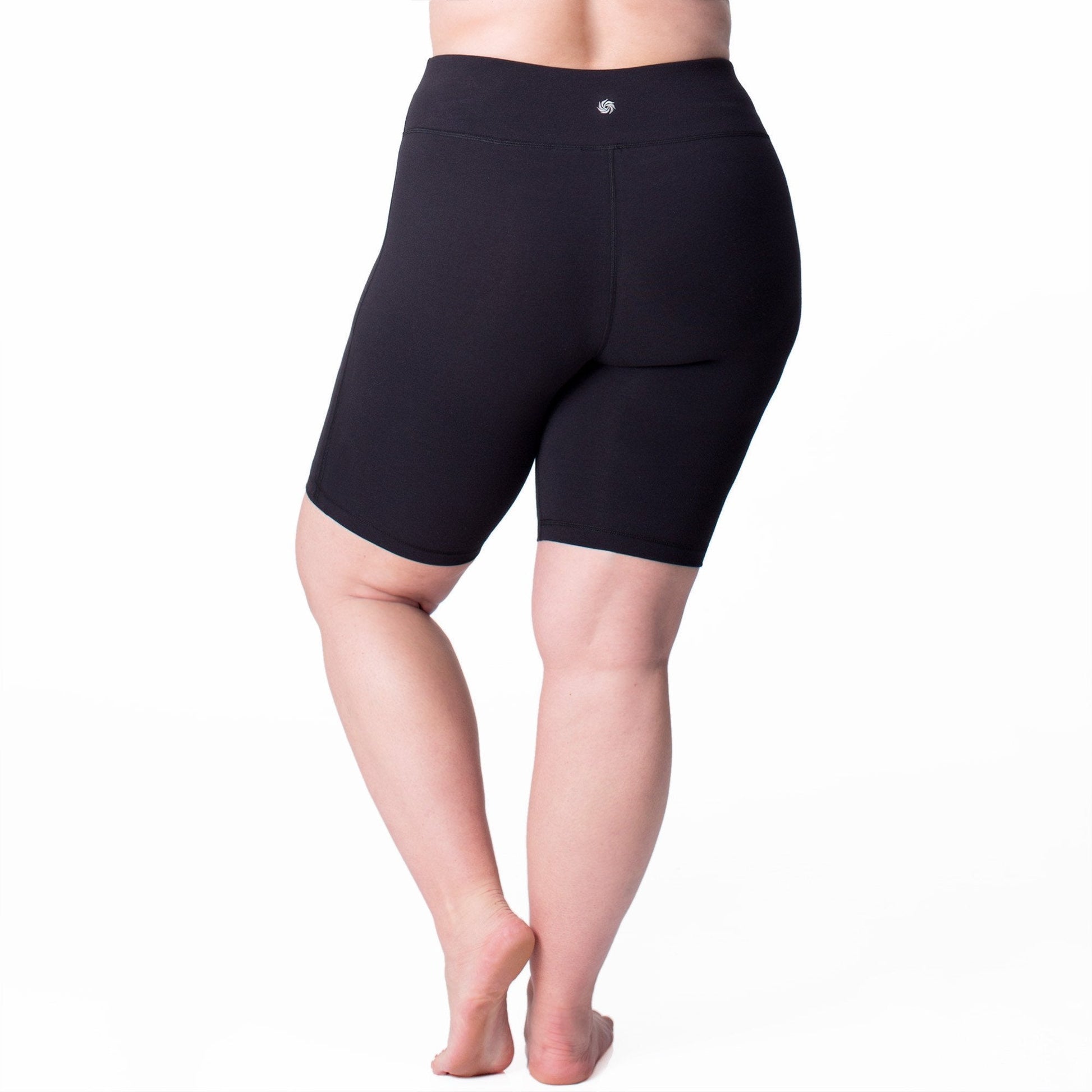 Navy bike shorts, mid-thigh length with seam details and small logo at waist