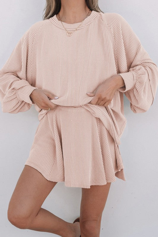 Corded top and ruffle mini skirt set in blush pink, tied waist detail and flared skirt