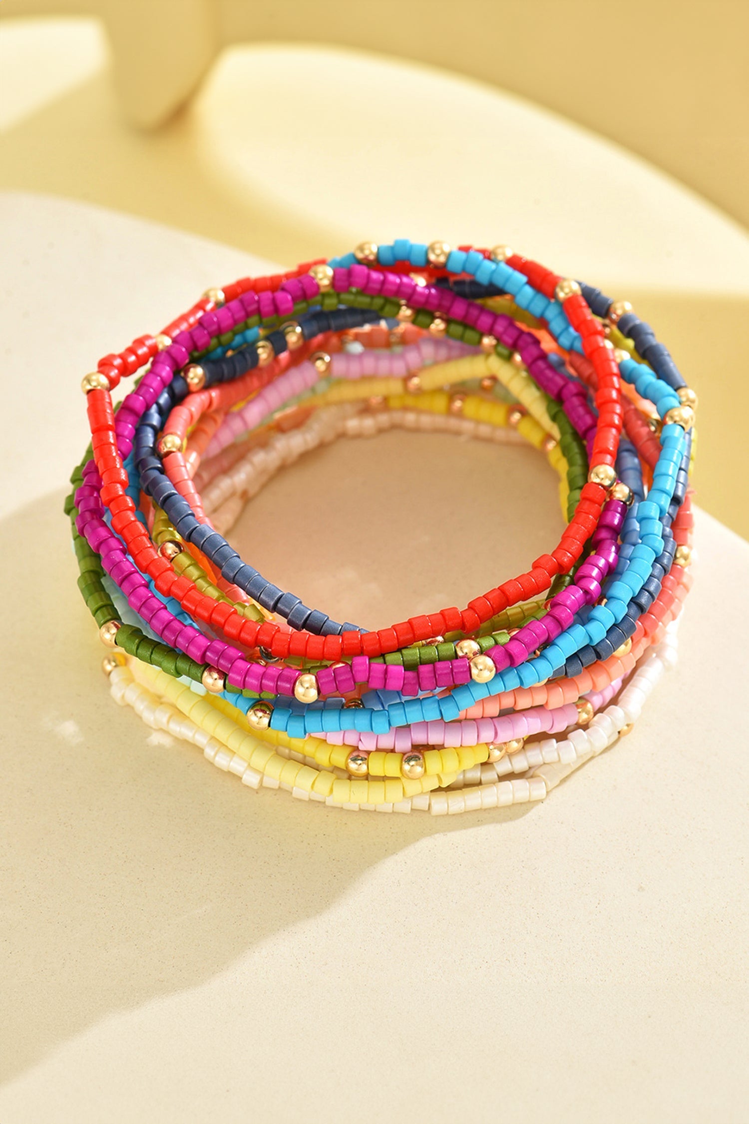 Beaded stretch bracelet set with multicolor beads and gold-tone center beads