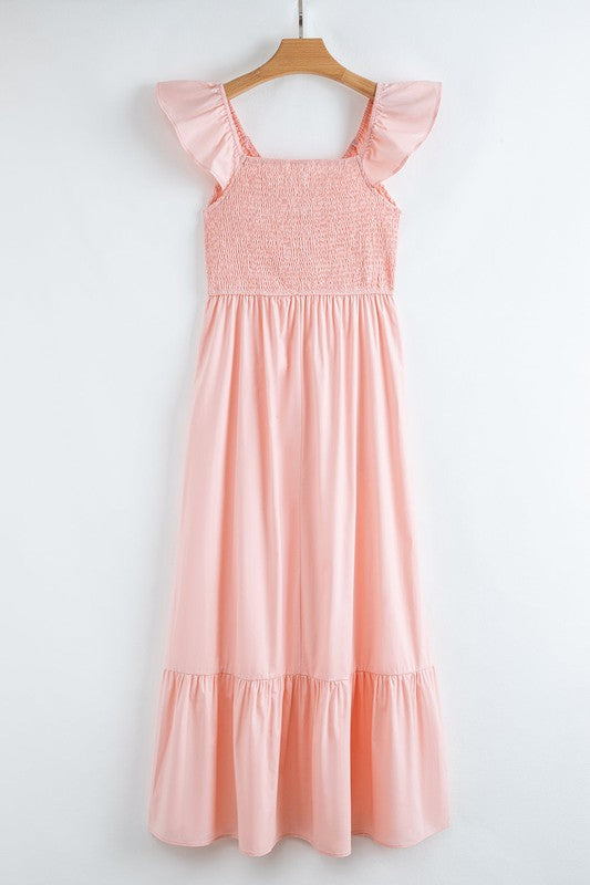 Peach smocked maxi dress with square neckline, flutter sleeves, and tiered skirt