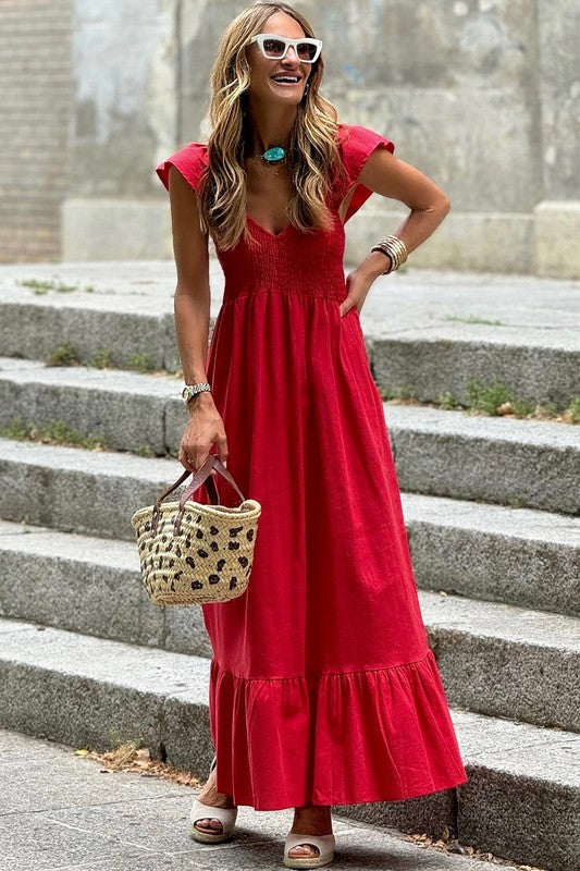 Red maxi dress with V-neck smocked bodice and gathered tiered ruffle hem.
