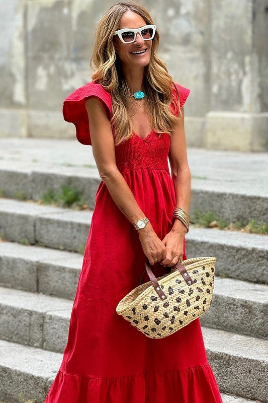 Red maxi dress with V-neck smocked bodice, cap sleeves, and tiered skirt.