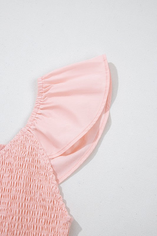 Peach flutter sleeve detail with smocked texture on maxi dress