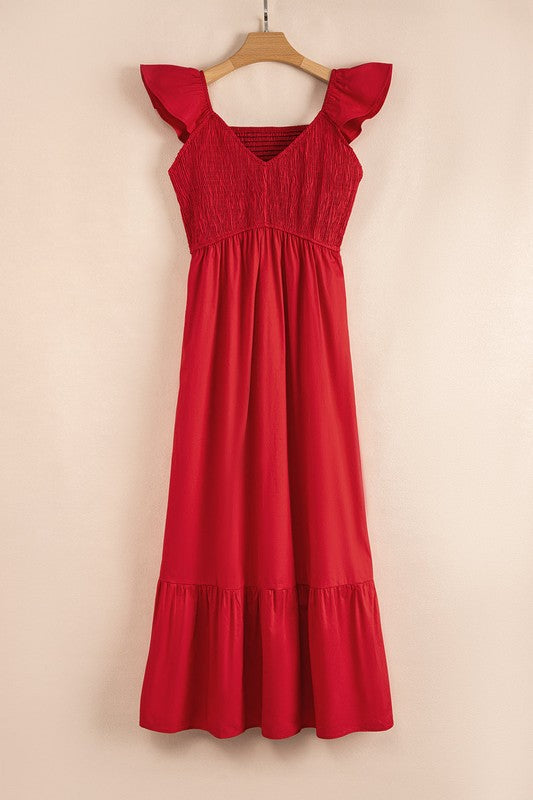 Red smocked maxi dress with flutter cap sleeves and tiered hem, hanging