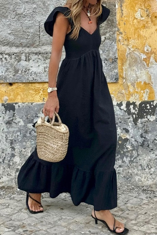 Black smocked maxi dress with V-neck, sleeveless puff shoulders, tiered ruffle hem