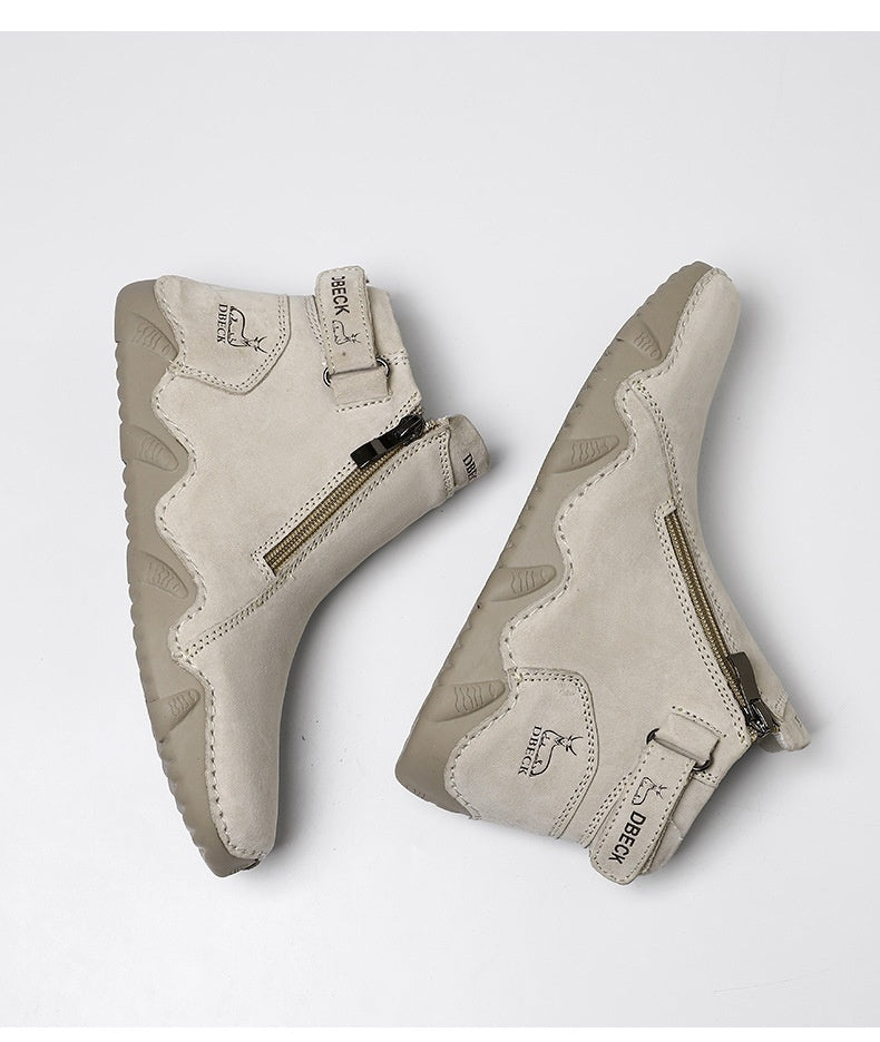 Pair of light beige high-top ankle boots with side zipper and padded, textured sole.