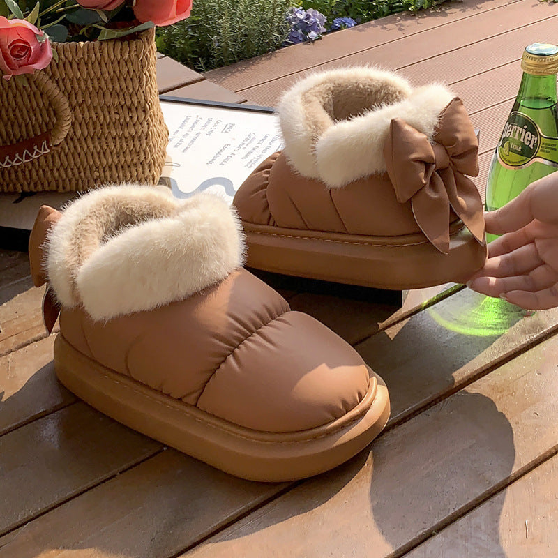 Tan winter ankle boots with faux fur cuff and large bow, platform rubber sole