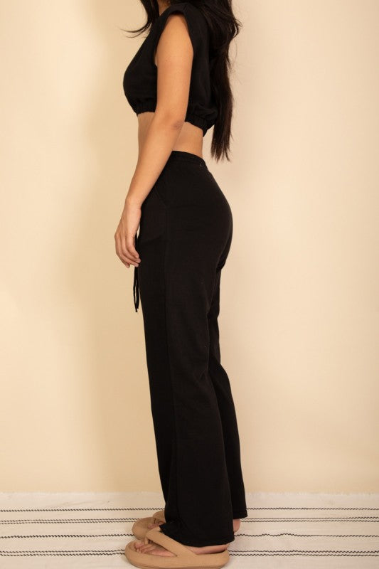 Black wide-leg pants and cropped top set, elastic waist and drawstring tie