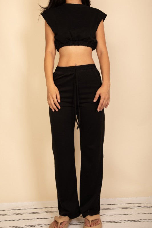 Black wide-leg pants and cropped top set with elastic waistband and short sleeves