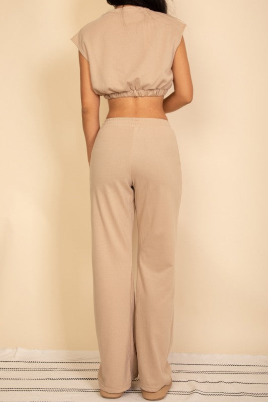 Beige crop top and wide-leg pants set with elastic hems, back view