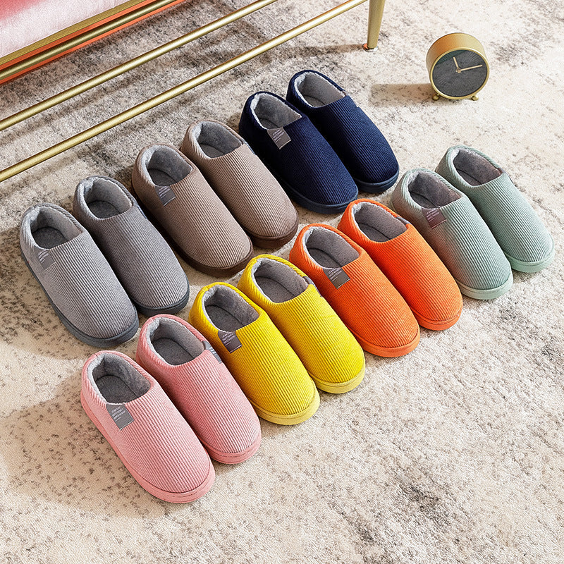 Women’s slip-on slippers in assorted colors with fuzzy gray lining and rubber sole