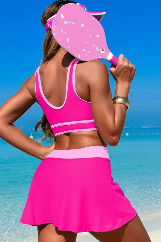 Two-piece high-waisted skirt swimsuit, fuchsia open-back crop top with trim and matching skirt